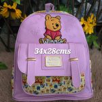 mochila plaquita en medio pooh