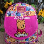 mochila plaquita arriba Pooh