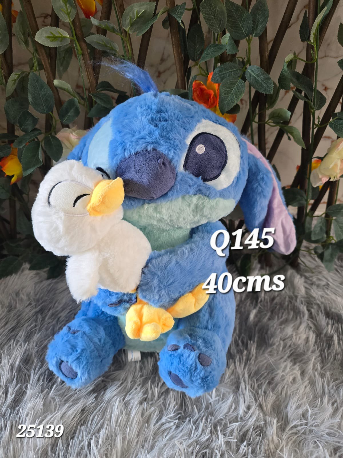 2026/06/1000009631.jpg peluche Stitch con pato 40cms - Imagen 1